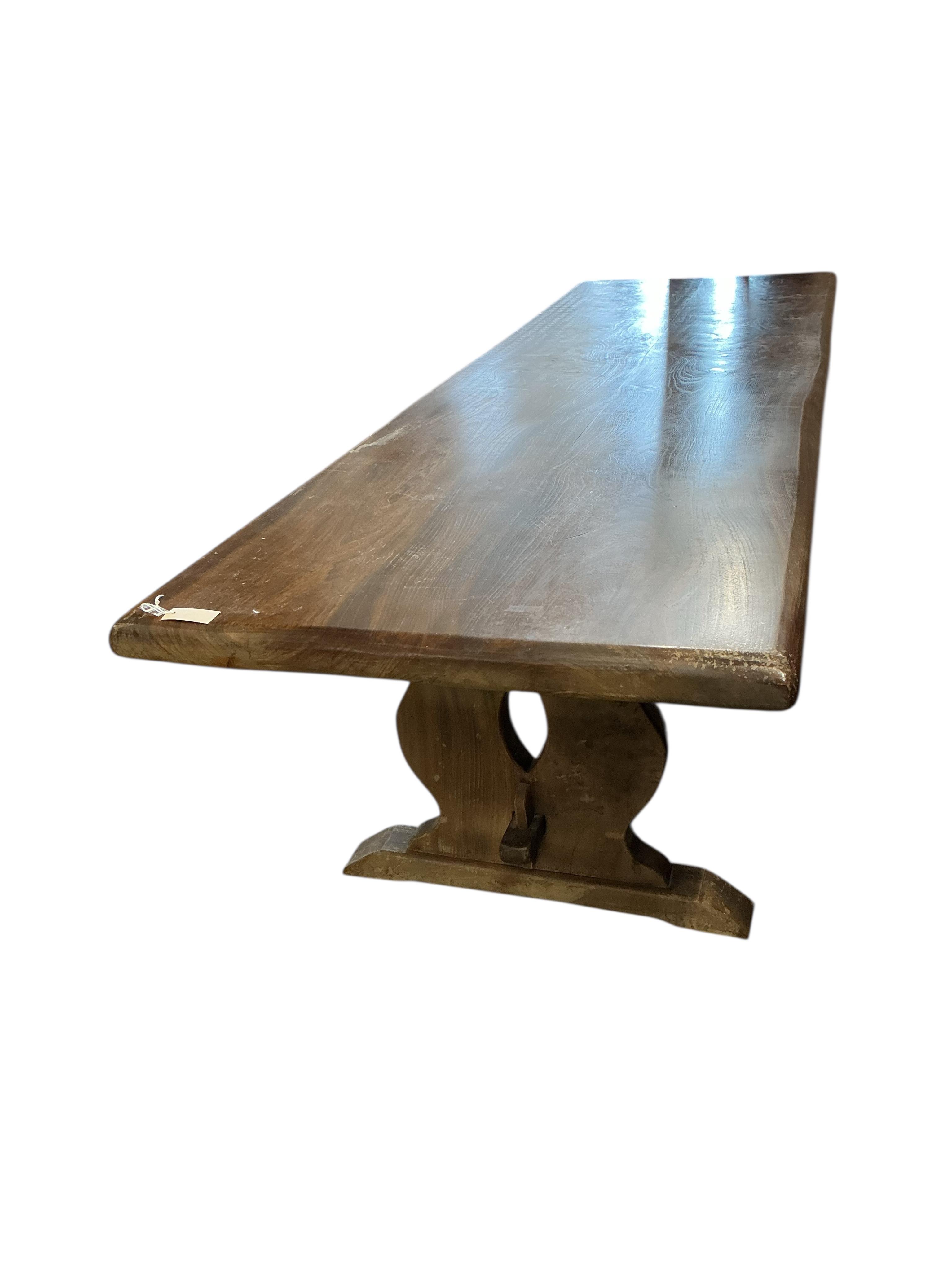 A 18th century style rectangular oak refectory dining table, width 294cm, depth 89cm, height 77cm